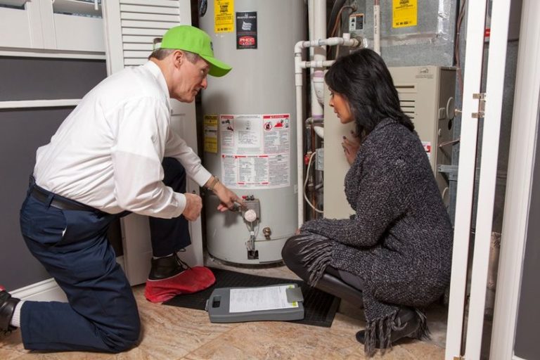 ABC plumbing technician operating on a standard water heater