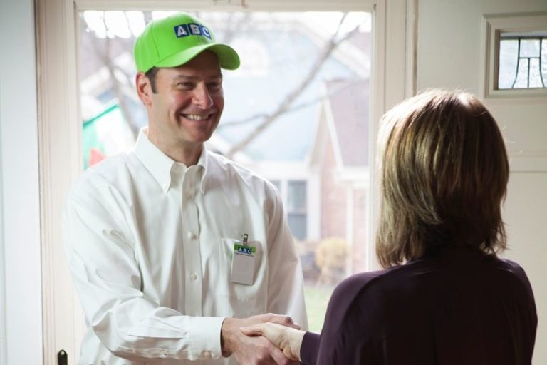 ABC technician shaking the hand of a homeowner in the doorway