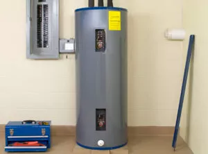 a water heater and fuse box next to a tool box